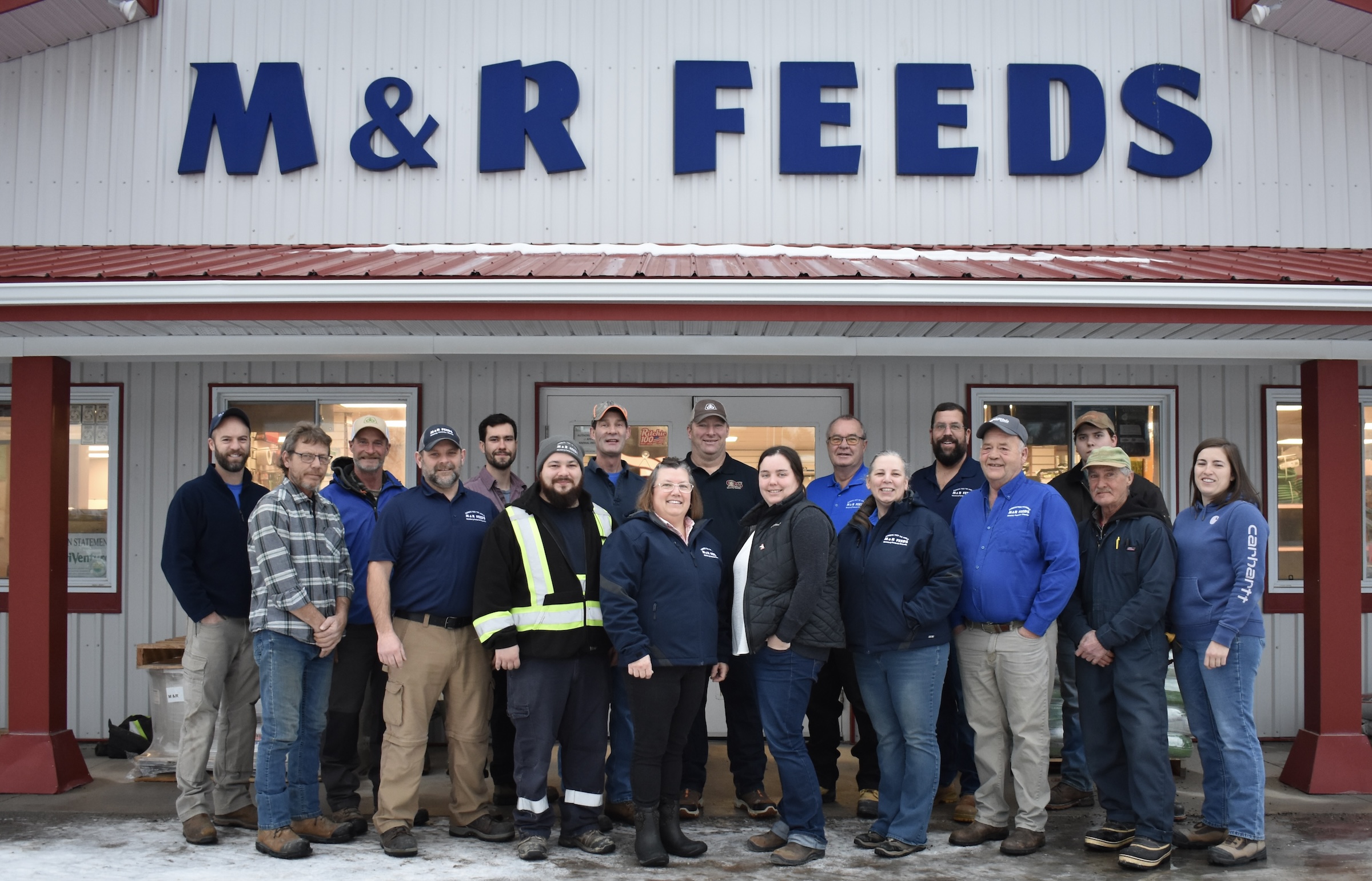 Staff in front of store
